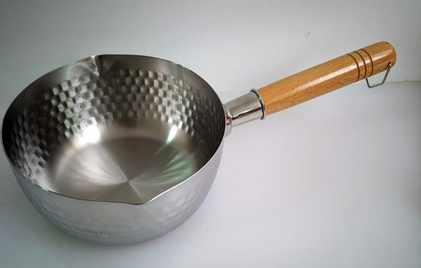 Saucepan with wooden hand